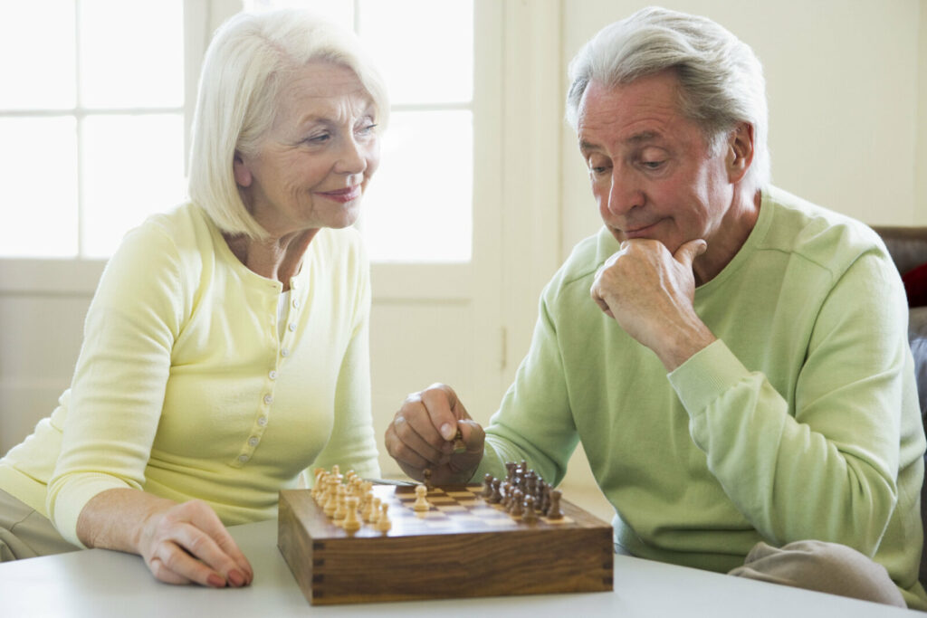 Mature couple playing chess